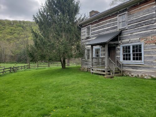 Built in the early 1800's, the original log home at River Mountain Retreat is now used as the central dining hall.